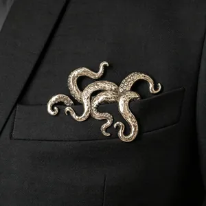 Gothic octopus tentacle brooch in vintage silver metal on black suit pocket