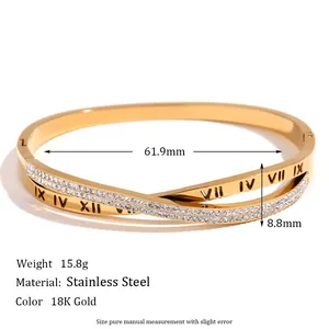 Crossed 18K gold plated stainless steel bracelet with micro-pave crystals and roman numerals