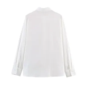 Classic white long-sleeved shirt with embroidered hollow design and formal lapel collar