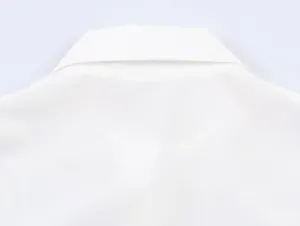 Close-up detail of the white turnover collar and woven fabric on the back of the shirt