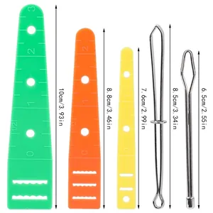 Detailed set of metal loop turners and plastic threading guides with size scales