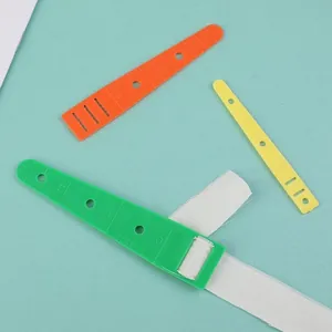 Macro view of plastic sewing gauge tool with scale markers for measuring fabric folds