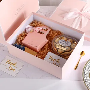 Pink gift box set with ribbon bow, matching paper bag and Ferrero Rocher chocolates
