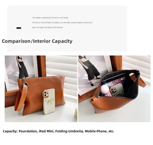 Brown textured clutch bag showing interior capacity for iPad Mini and essentials