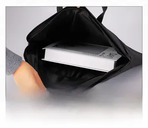 Close-up of the large capacity interior of this black minimalist nylon briefcase bag