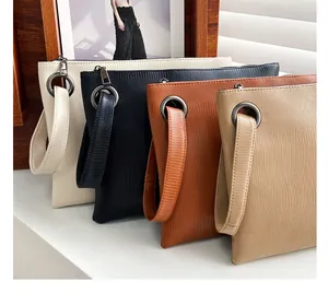 Lizard pattern envelope clutch bag collection in various colors with metal ring detail