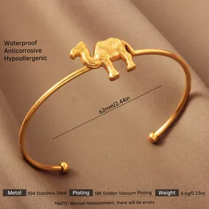 Detailed view of 18K gold plated stainless steel open bangle with camel relief pattern