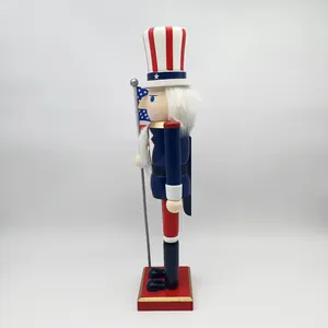 Side view of Uncle Sam nutcracker with white beard holding the American flag