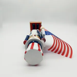 Top-down view of a wooden Independence Day nutcracker with flag and uncle sam outfit