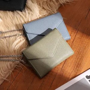 Slim leather mini envelope bag with chain strap in light blue and olive green colors
