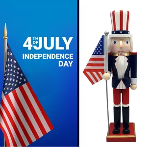 Patriotic July 4th Uncle Sam wooden nutcracker holding American flag on red base