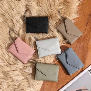 Slim leather envelope wristlet wallets with pebble grain texture and silver chains