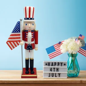 Uncle Sam wooden nutcracker soldier holding a US flag for 4th of July celebration