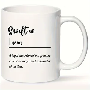 Detail of 11oz white ceramic mug featuring Swiftie definition printed in black text
