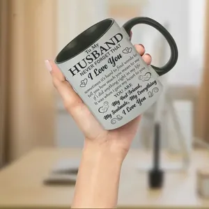 Close-up of 11oz white ceramic mug with black handle and heartfelt letter printing