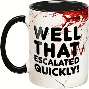 Detail of 11oz ceramic mug with black handle and 'WELL THAT ESCALATED QUICKLY!' print