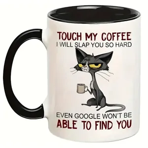 Close-up of 11oz ceramic coffee mug with funny black cat illustration and bold lettering