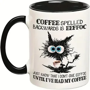 Detailed close-up of a 11oz ceramic mug with a creative cat graphic and contrast black handle