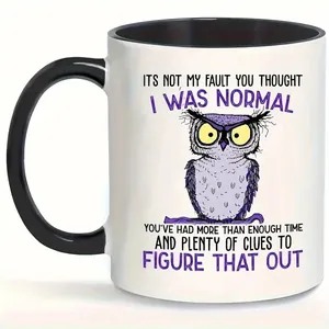 Detail of creative ceramic mug showing funny cartoon owl and humorous quote print
