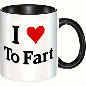 Close-up of 11oz ceramic mug with humorous text print and contrasting black handle