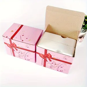 Pink gift box with red ribbon print and protective foam insert for ceramic mugs