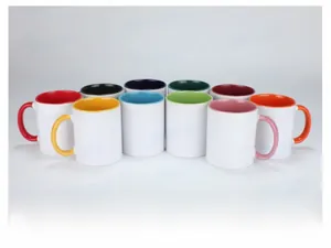 Detail showing the inner color glaze and smooth white ceramic exterior of the mugs