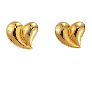 Polished 18K gold plated heart stud earrings for women in minimalist modern style