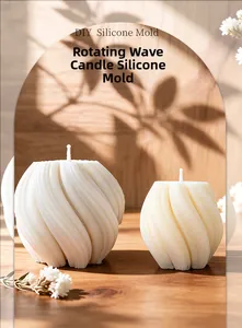 Detailed view of white rotating wave candles made with the DIY silicone mold