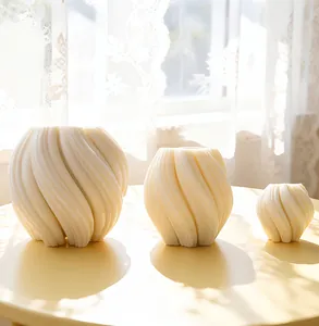 Three cream-colored 3D spiral textured decorative vases in large, medium, and small sizes