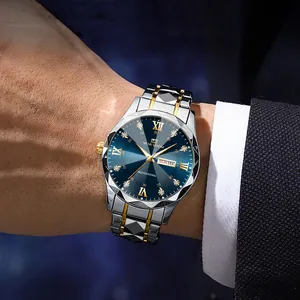 Business men's watch with blue sunray dial and gold silver steel strap on a wrist