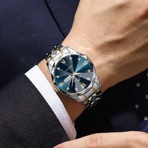 Men's business watch with blue diamond dial and two-tone steel band on wrist