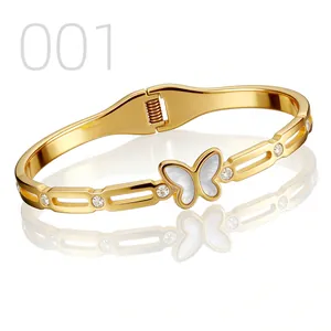 Detailed macro view of the butterfly gold bangle featuring mother of pearl and zircons