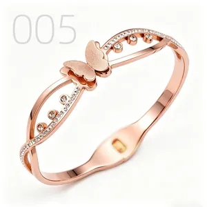 Detail of rose gold butterfly bangle with hollow wave frame and sparkling zircons