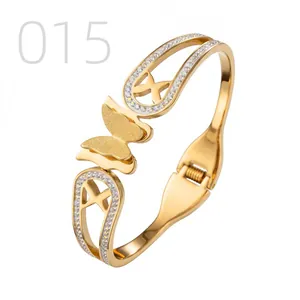 Macro detail of gold-plated butterfly bangle with sparkling rhinestones and hinge
