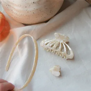 Three-piece hair accessory set with acetate headband and marble texture clips