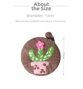 Detail view of 13cm handmade cactus felt coin purse with zipper and wool ball charm