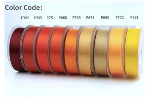 Detailed view of nine warm gradient satin ribbons on rolls with distinct color codes