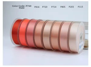 Macro shot of 8 gradient satin ribbon rolls with smooth glossy finish and color labels
