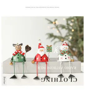 Detailed view of metal Christmas hanging ornaments with Santa Claus and snowman motifs