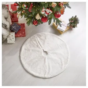 Macro detail of plush white faux fur Christmas tree skirt on light wooden floor
