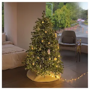 Cozy white faux fur Christmas tree skirt with plush texture under glowing holiday tree