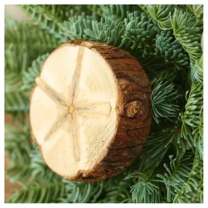Macro shot of circular wood slice with natural star grain and bark for table decor