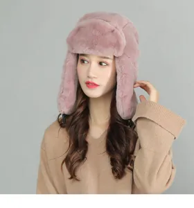 Detail of pink faux fur winter trapper hat showing soft thick texture and ear flaps