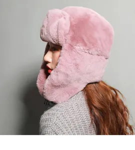 Close-up of pink faux fur trapper hat with soft plush texture and ear flaps for winter
