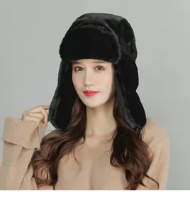 Detail of black faux fur trapper hat featuring warm ear flaps and thick plush lining