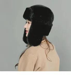 Side view of black faux fur trapper hat with ear flaps for winter warmth and wind protection