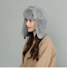 Detail view of deep grey plush trapper hat with windproof earflaps and buckle strap