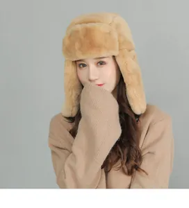 Detail of warm khaki plush earflap hat with thick faux fur lining for winter protection