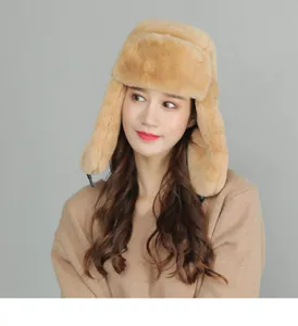 Close-up of thick plush faux fur lining and ear flaps on a warm winter trapper hat