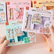 Detail of hand-held Korean plaid washi tape set and DIY stationery stickers in pastel box